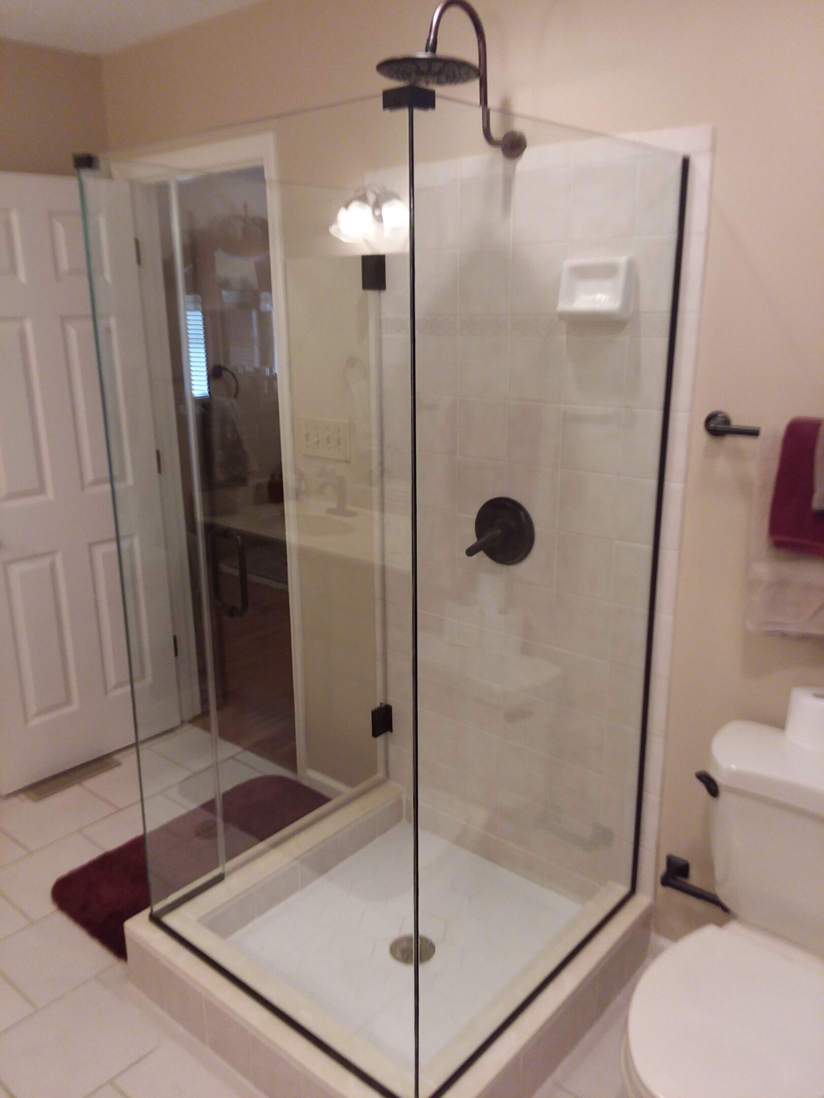 A bathroom with a shower and toilet in it