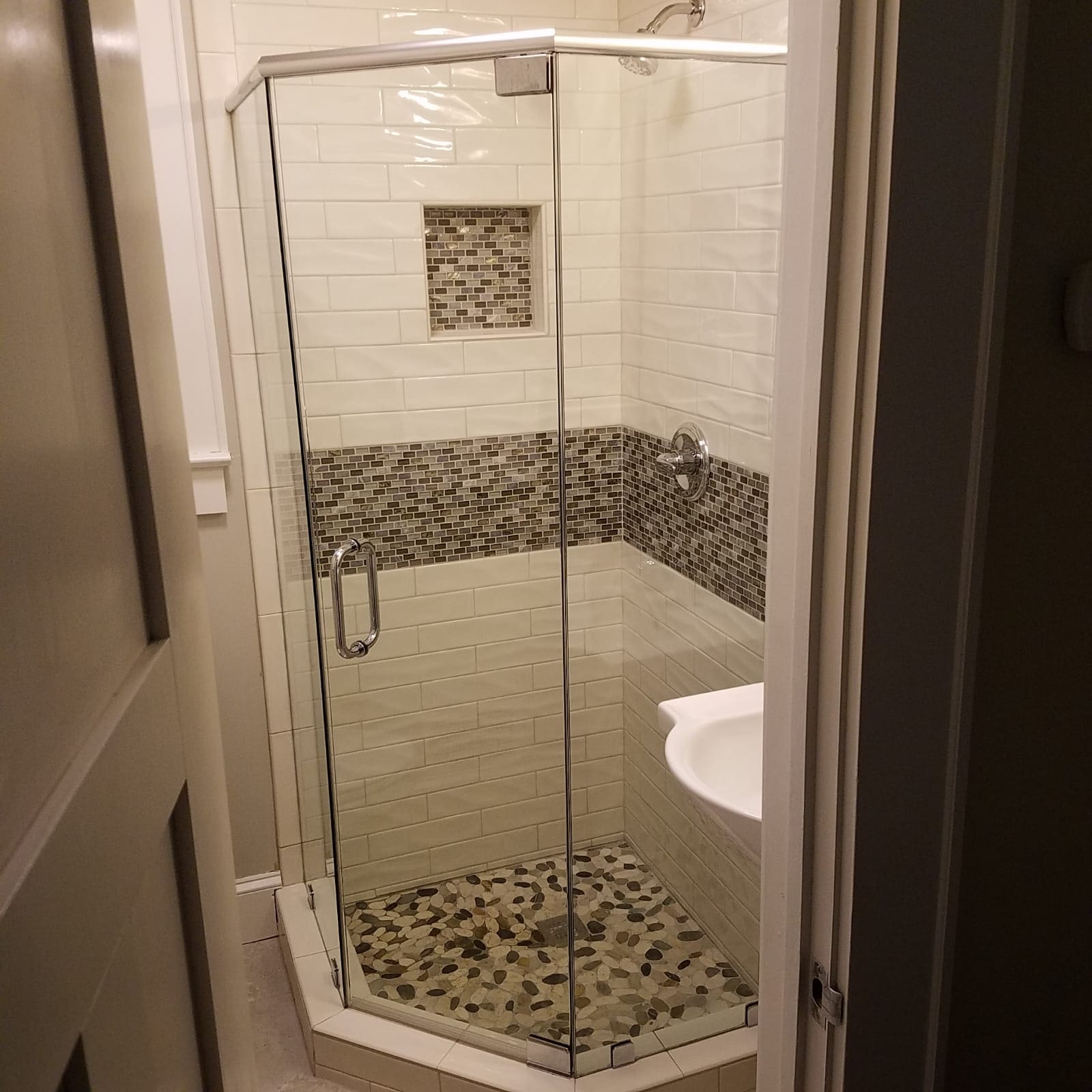 A bathroom with a shower and toilet in it