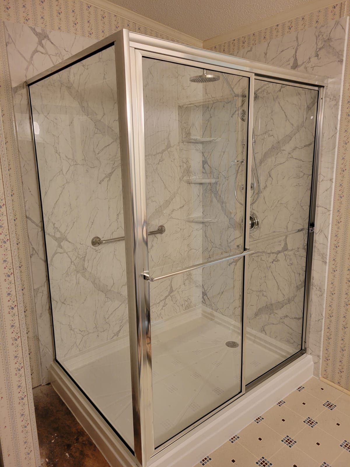 A shower with two sliding doors and shelves.