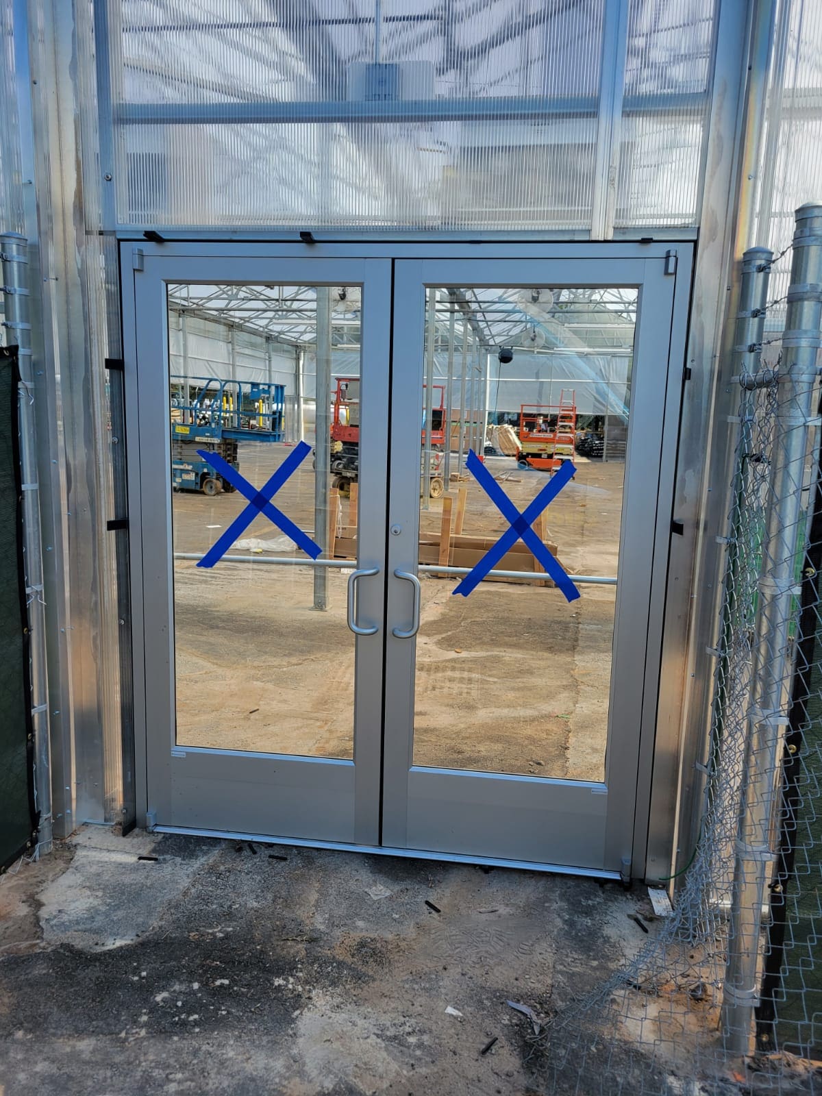 A double door with blue lines on it