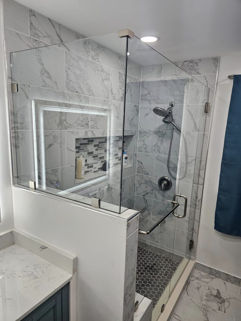 A bathroom with marble walls and floors